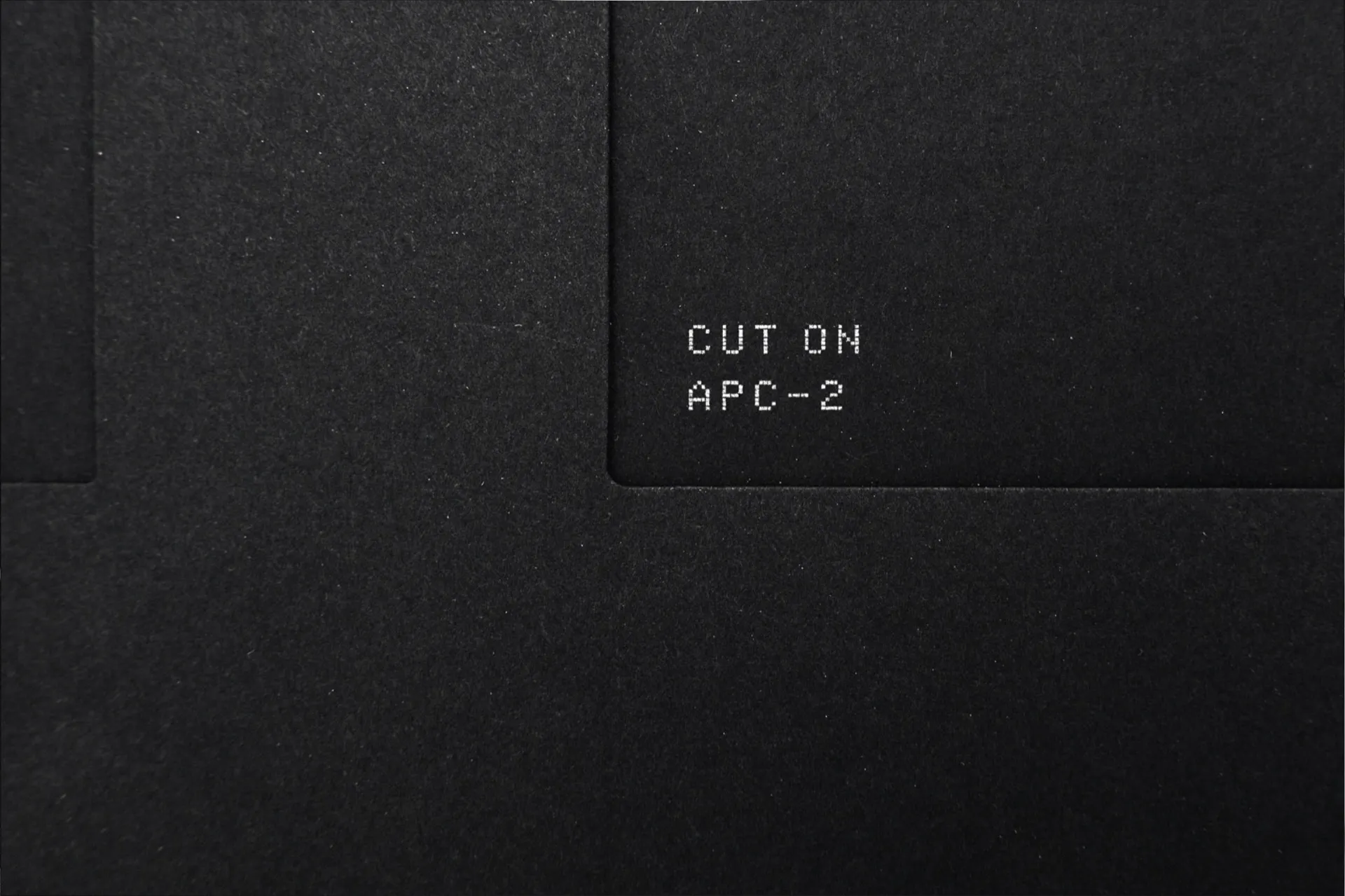 The PHONOCUT SLIDE packaging in black recycled paper